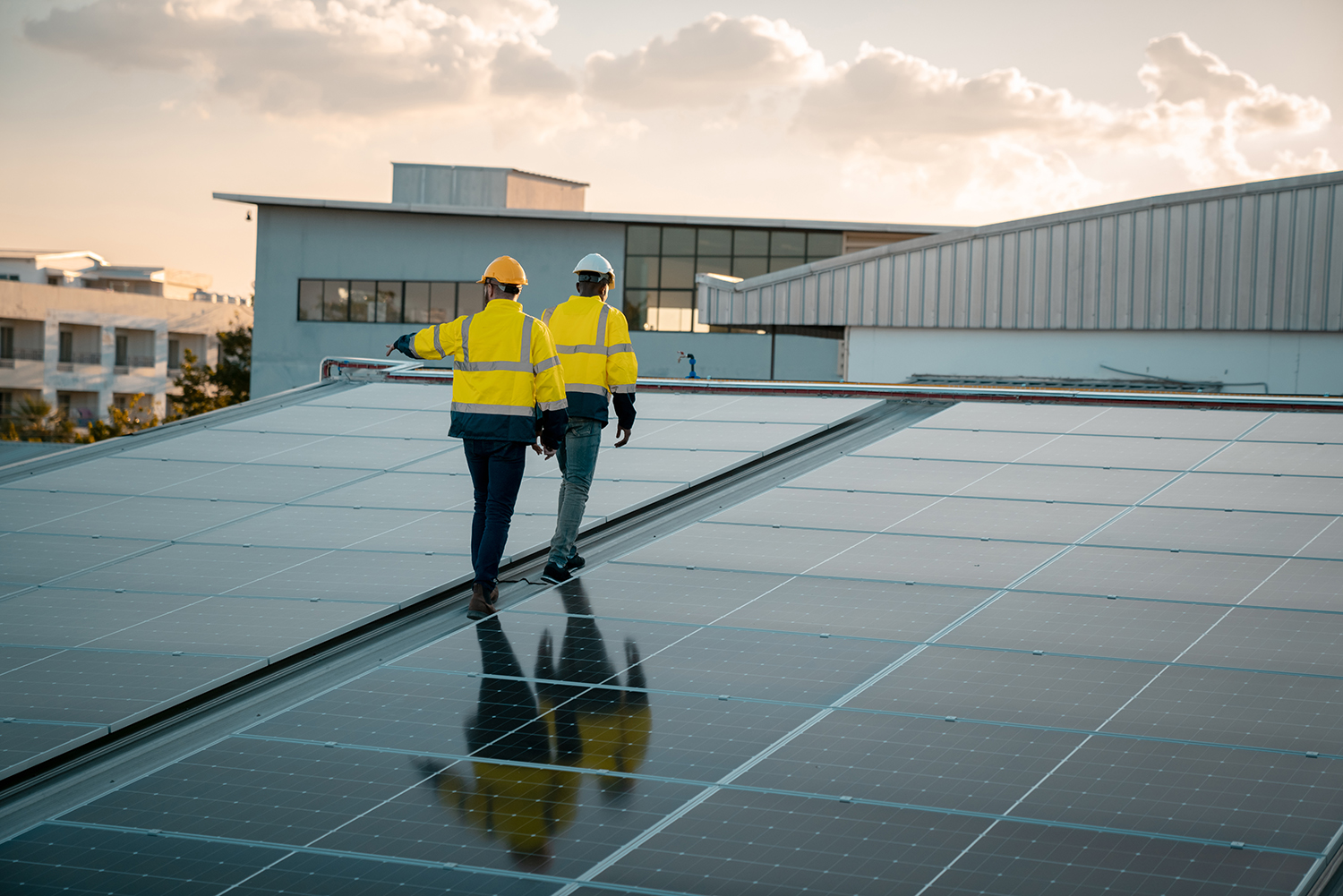 Service engineer checking solar cell on the roof for maintenance if there is a damaged part. Engineer worker install solar panel. Clean energy concept.